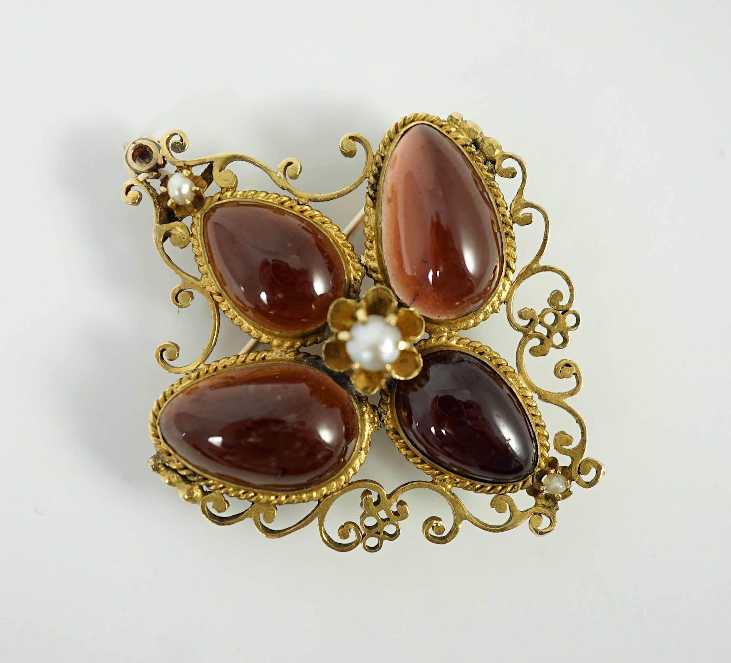 A Victorian gold, four stone garnet and three stone split pearl set mourning pendant brooch